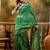 green banarasi jacquard saree with elegant zari weaving & tassel pallu     includes unstitched blouse