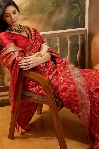 red banarasi jacquard saree with rich zari weaving & tassel pallu     includes unstitched blouse