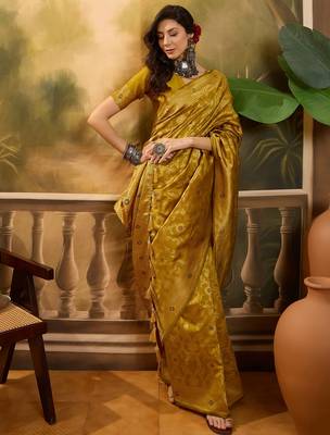 mustard banarasi jacquard saree with rich zari weaving & tassel pallu     unstitched blouse included 1