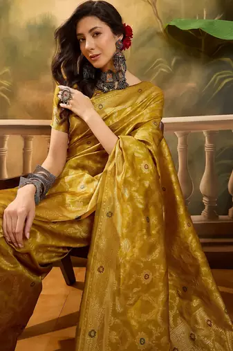 mustard banarasi jacquard saree with rich zari weaving & tassel pallu     unstitched blouse included
