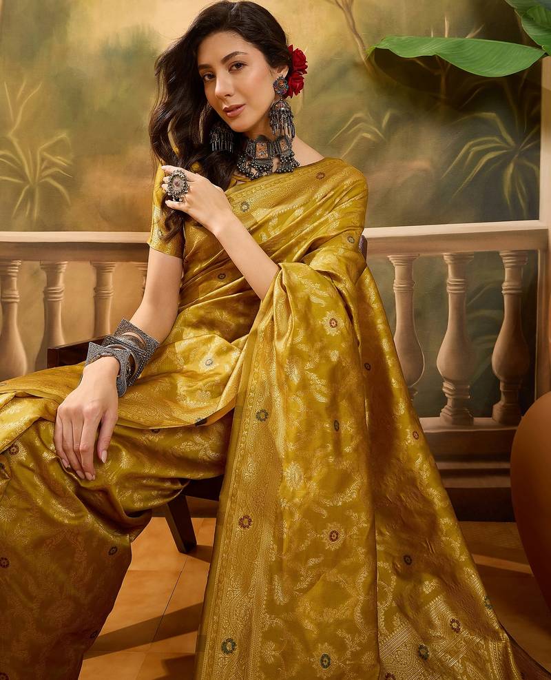 mustard banarasi jacquard saree with rich zari weaving & tassel pallu     unstitched blouse included
