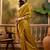 mustard banarasi jacquard saree with rich zari weaving & tassel pallu     unstitched blouse included