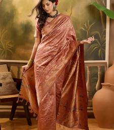rose gold banarasi jacquard saree with zari weaving & tassel pallu     unstitched blouse included