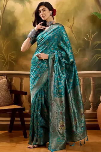 teal blue banarasi jacquard saree with zari weaving & tassel pallu     unstitched blouse included