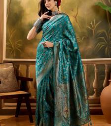 teal blue banarasi jacquard saree with zari weaving & tassel pallu     unstitched blouse included