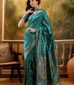 teal blue banarasi jacquard saree with zari weaving & tassel pallu     unstitched blouse included