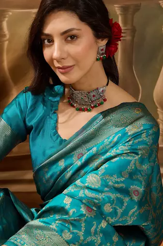 teal blue banarasi jacquard saree with zari weaving & tassel pallu     unstitched blouse included