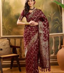 maroon banarasi jacquard saree with zari weaving & tassel pallu     unstitched blouse material
