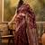 maroon banarasi jacquard saree with zari weaving & tassel pallu     unstitched blouse material