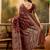 maroon banarasi jacquard saree with zari weaving & tassel pallu     unstitched blouse material