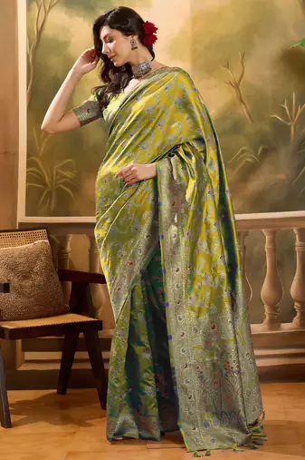 elegant green banarasi jacquard saree with rich zari weaving & tassel pallu     unstitched blouse