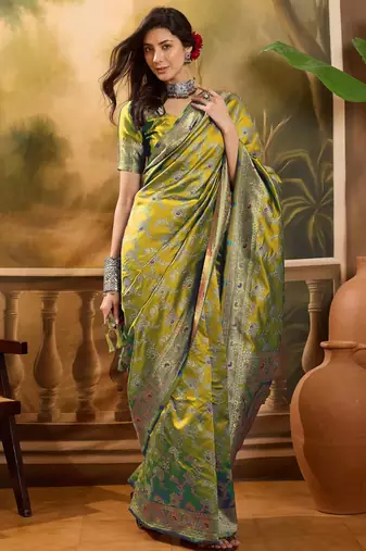 elegant green banarasi jacquard saree with rich zari weaving & tassel pallu     unstitched blouse