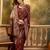 regal maroon banarasi jacquard saree with zari weaving & tassel pallu     unstitched blouse
