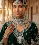 Green 2-layer bridal jewelry set with earrings, maang tikka, pasha, nath & panja | rhodium plated