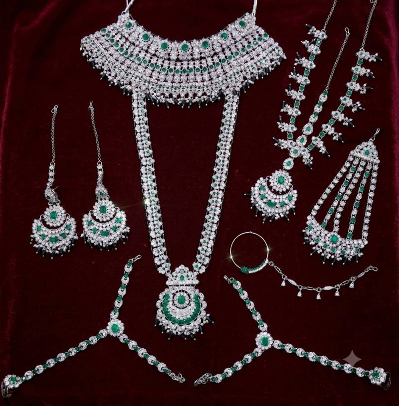 Green 2-layer bridal jewelry set with earrings, maang tikka, pasha, nath & panja | rhodium plated