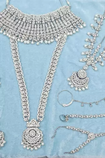 White 2-layer bridal jewelry set with earrings, maang tikka, pasha, nath & panja | rhodium plated