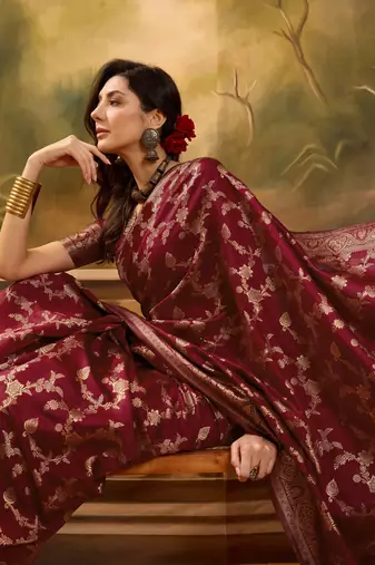 maroon banarasi jacquard saree with rich golden zari weaving & tassel pallu     unstitched blouse