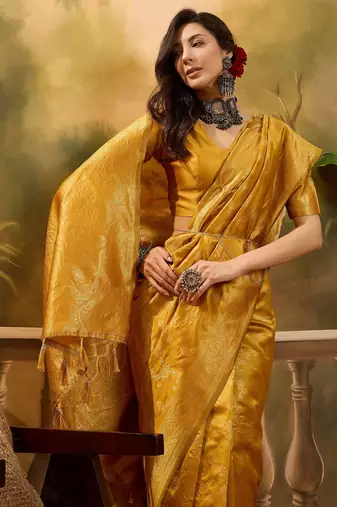golden banarasi jacquard saree with rich zari weaving & tassel pallu     unstitched blouse