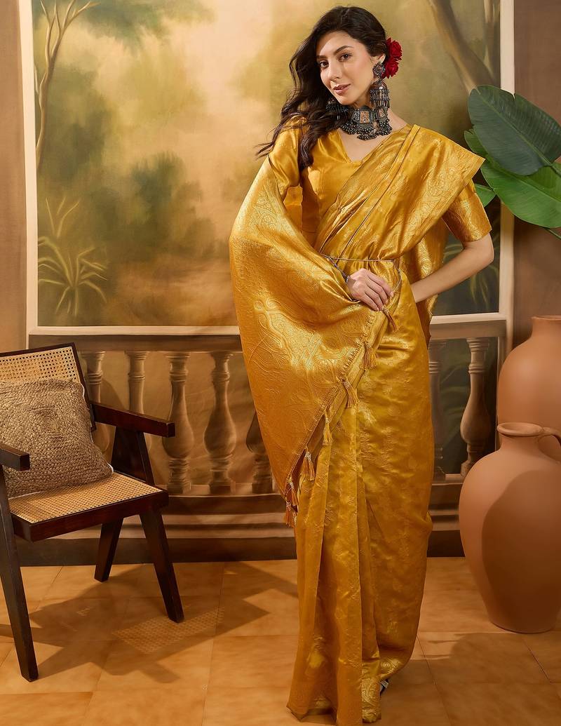 golden banarasi jacquard saree with rich zari weaving & tassel pallu     unstitched blouse