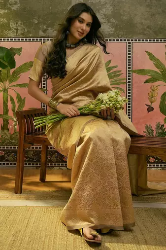 beige woven design saree with subtle border