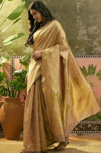 beige woven design saree with subtle border
