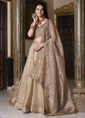 Beige sequins and thread embroidered gold rush fabric lehenga choli dupatta 1
