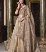 Beige sequins and thread embroidered gold rush fabric lehenga choli dupatta