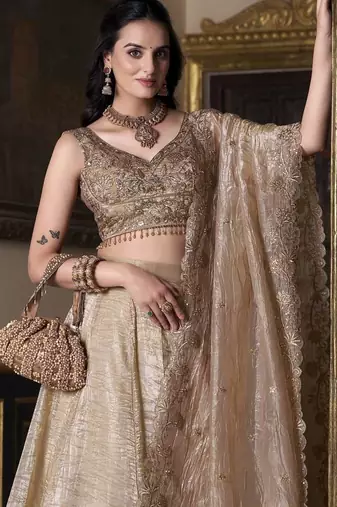 Beige sequins and thread embroidered gold rush fabric lehenga choli dupatta