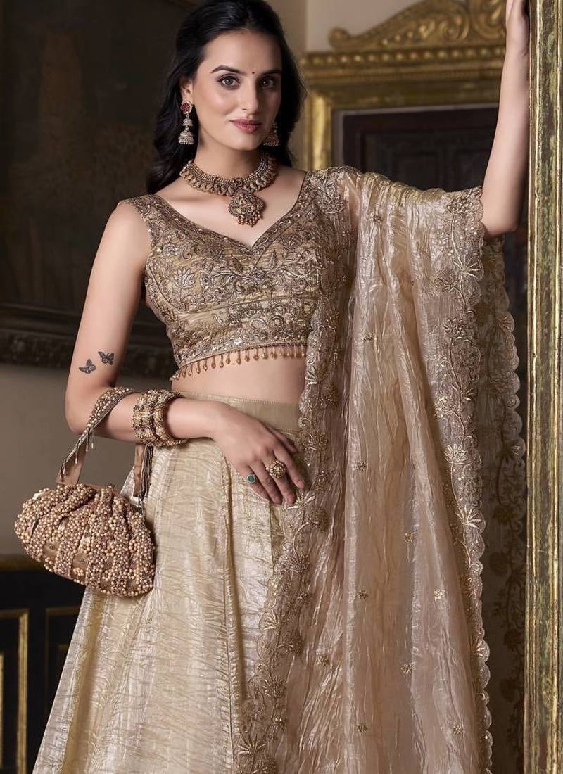 Beige sequins and thread embroidered gold rush fabric lehenga choli dupatta