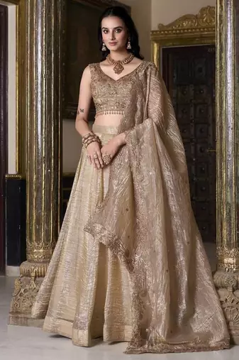 Beige sequins and thread embroidered gold rush fabric lehenga choli dupatta