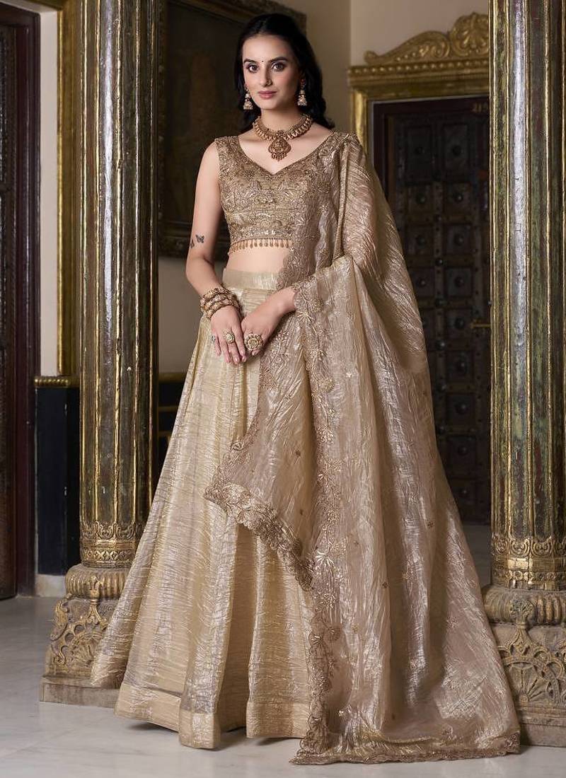 Beige sequins and thread embroidered gold rush fabric lehenga choli dupatta