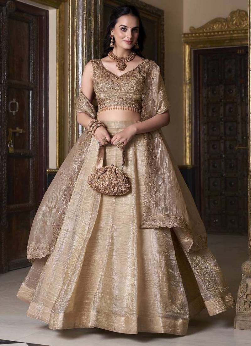Beige sequins and thread embroidered gold rush fabric lehenga choli dupatta