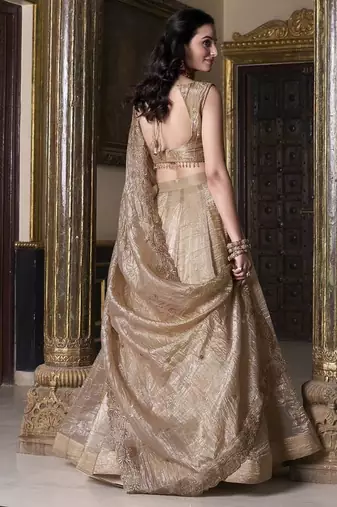 Beige sequins and thread embroidered gold rush fabric lehenga choli dupatta