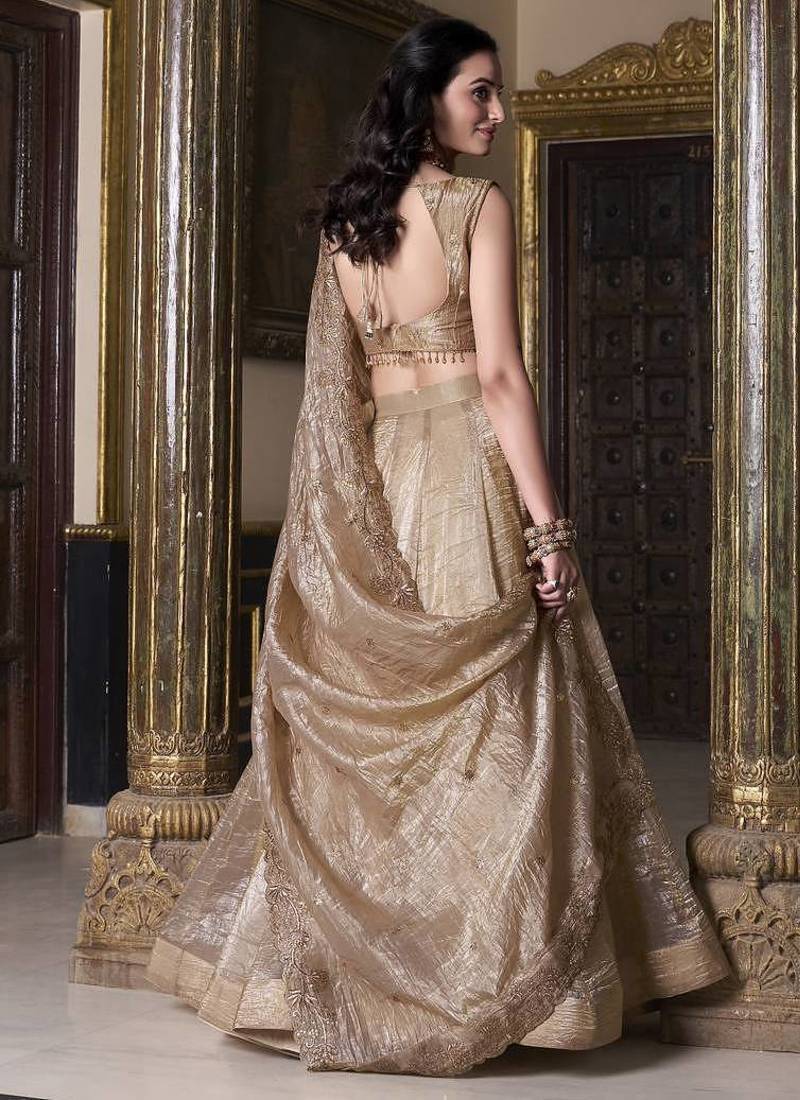 Beige sequins and thread embroidered gold rush fabric lehenga choli dupatta
