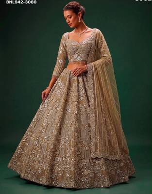 Beige Net Heavily Embroidered Royal Bridal Reception Lehenga Choli Set 1