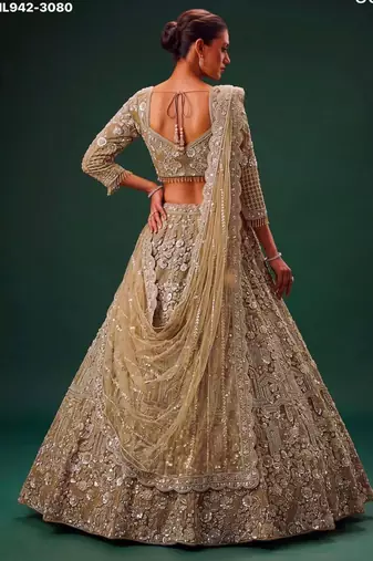 Beige Net Heavily Embroidered Royal Bridal Reception Lehenga Choli Set