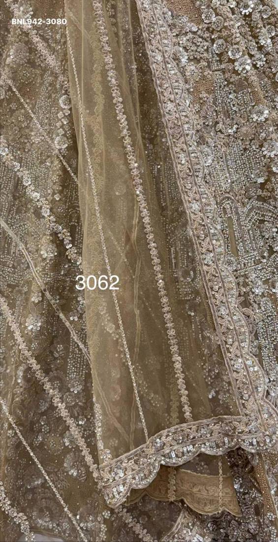 Beige Net Heavily Embroidered Royal Bridal Reception Lehenga Choli Set