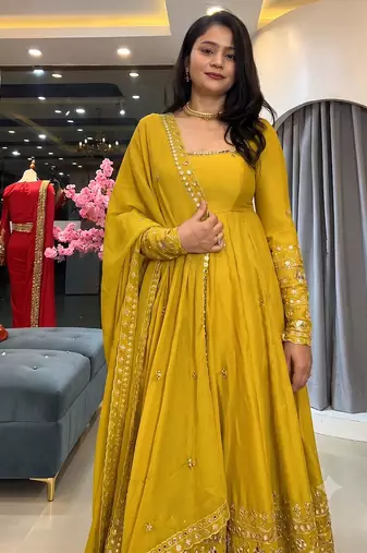 Yellow heavily embroidered anarkali suit set