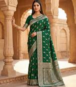 Green soft silk blend saree with zari weaving meenakari design