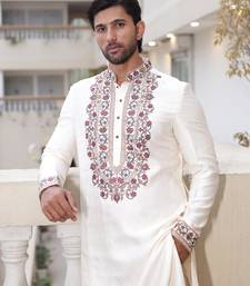 Ivory embroidered festive kurta with placket and hem detailing for men