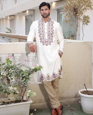 Ivory embroidered festive kurta with placket and hem detailing for men 1