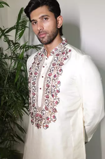 Ivory embroidered festive kurta with placket and hem detailing for men