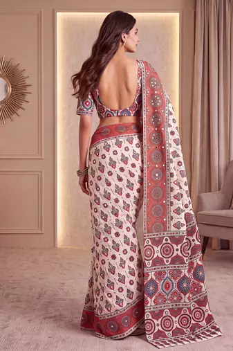 Cream ajrakh print crepe silk blend saree with mirror work blouse