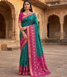 Sea green soft silk blend pochampalli saree with zari weaving meenakari design