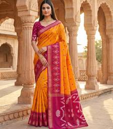 Orange soft silk blend pochampalli saree with zari weaving meenakari design