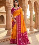 Orange soft silk blend pochampalli saree with zari weaving meenakari design