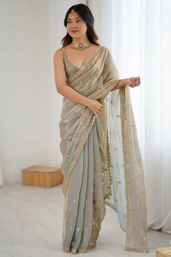 beige color silk blend  bollywood style glamorous ceremonial saree