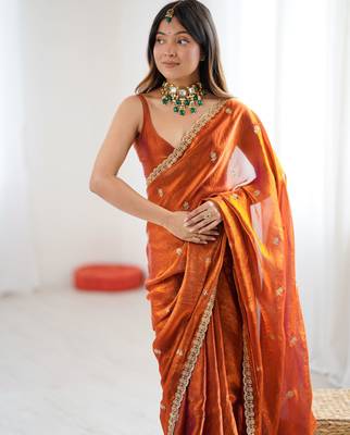 orange color silk blend  bollywood style glamorous ceremonial saree 3