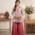 Rust red floral printed peplum kurti with matching flared palazzo set