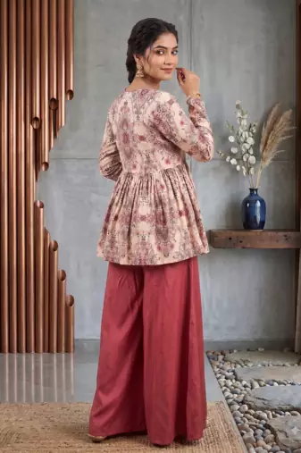 Rust red floral printed peplum kurti with matching flared palazzo set